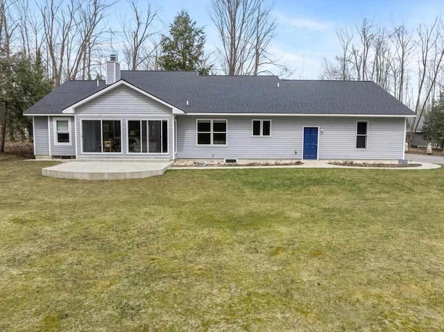 8913 Horseshoe Dr, Harbor Springs, MI 49740 - rear view of property with a patio, a yard, a shingled roof, and a chimney