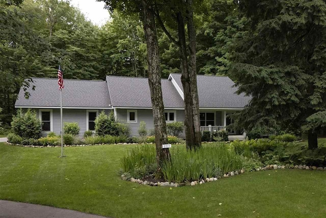 8913 Horseshoe Dr, Harbor Springs, MI 49740 - back of house with a yard