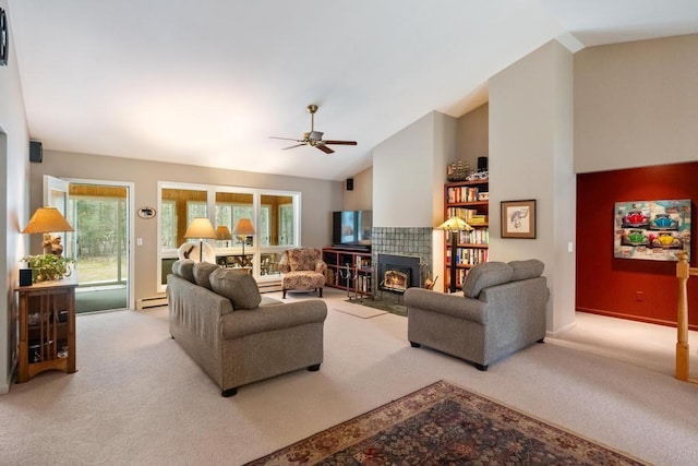 8913 Horseshoe Dr, Harbor Springs, MI 49740 - living area with carpet floors, a baseboard radiator, ceiling fan, a fireplace, and lofted ceiling