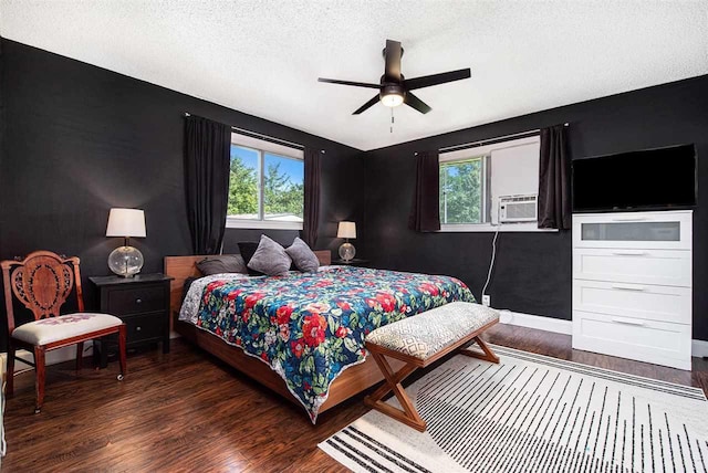 11601 Sequanota Heights Dr, Charlevoix, MI 49720 - bedroom featuring a textured ceiling, wood finished floors, and multiple windows