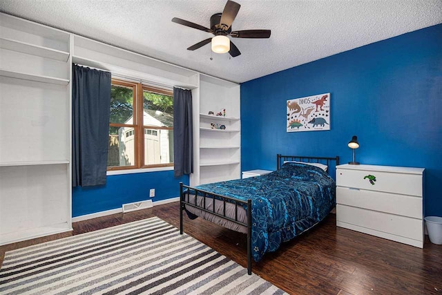 11601 Sequanota Heights Dr, Charlevoix, MI 49720 - bedroom featuring visible vents, wood finished floors, a ceiling fan, and a textured ceiling