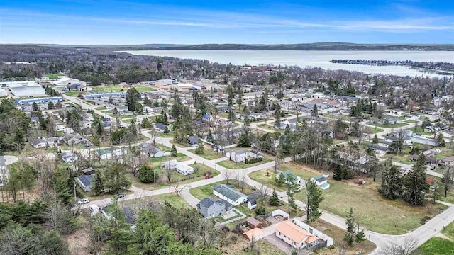 birds eye view of property featuring a water view and a residential view