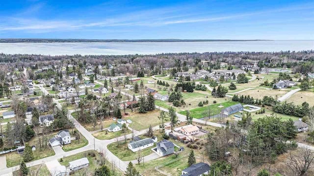 birds eye view of property featuring a water view and a residential view