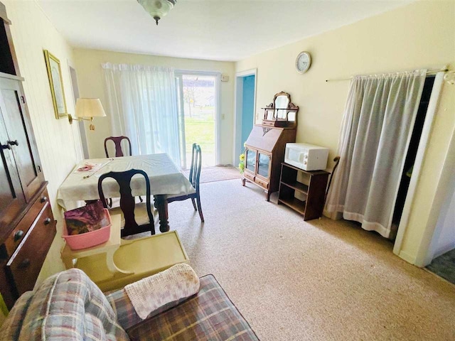 dining area featuring carpet flooring