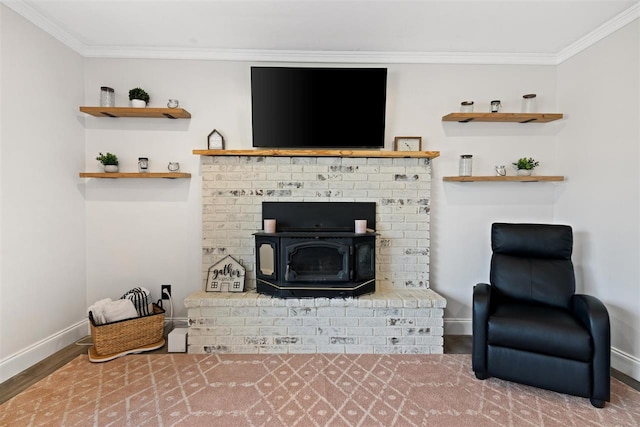 living area with crown molding, baseboards, and wood finished floors