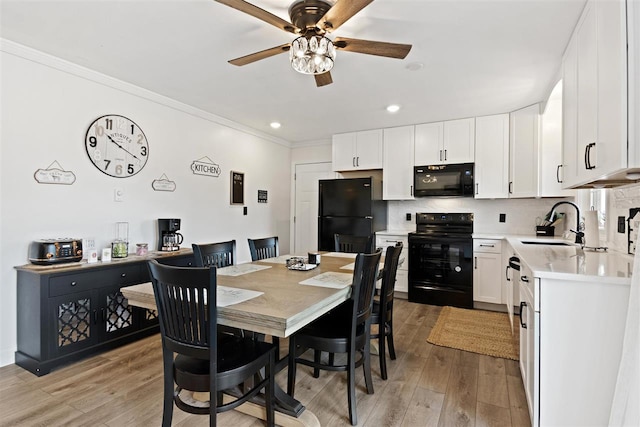 dining room with crown molding, ceiling fan, recessed lighting, and light wood-style flooring