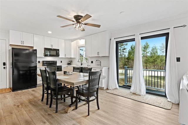 dining space with light wood-type flooring, a ceiling fan, and recessed lighting