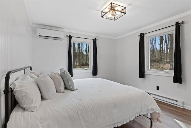 bedroom with a wall mounted air conditioner, wood finished floors, a baseboard radiator, a chandelier, and ornamental molding