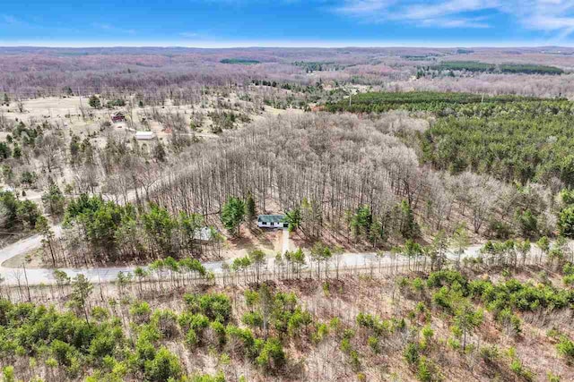 drone / aerial view with a view of trees