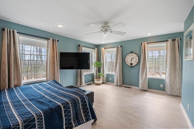 bedroom with baseboards, a ceiling fan, recessed lighting, and wood finished floors