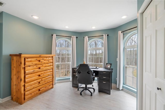 office area featuring recessed lighting, baseboards, light wood finished floors, and visible vents