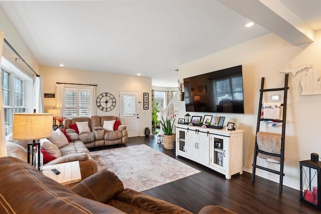 living room with recessed lighting and dark wood-style flooring