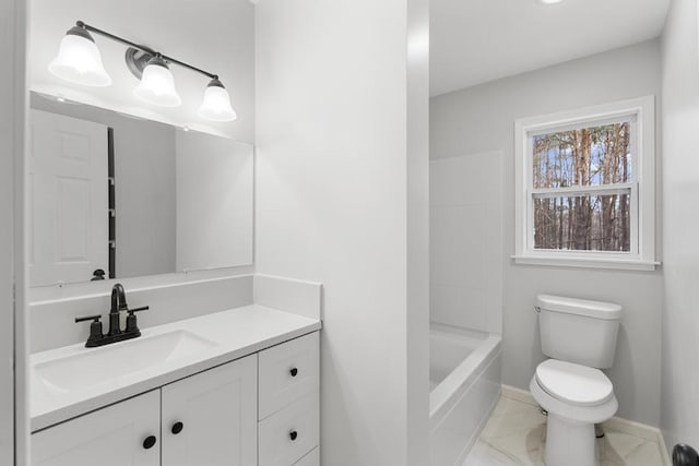 full bath with baseboards, vanity, toilet, and marble finish floor