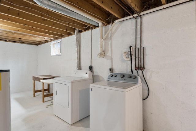 clothes washing area with separate washer and dryer and laundry area