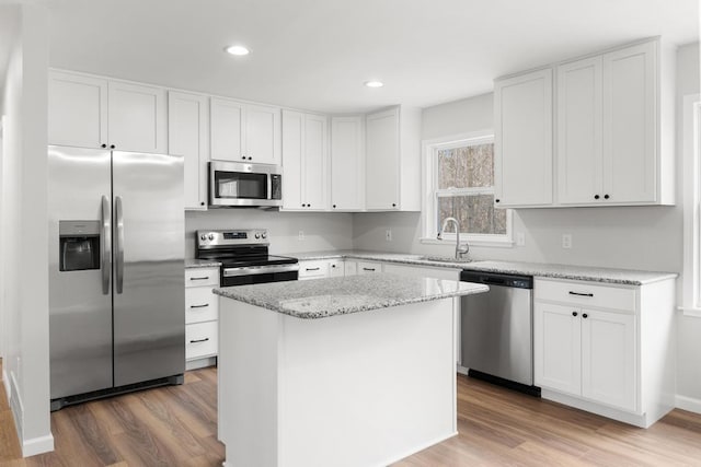 kitchen featuring a sink, white cabinetry, and appliances with stainless steel finishes