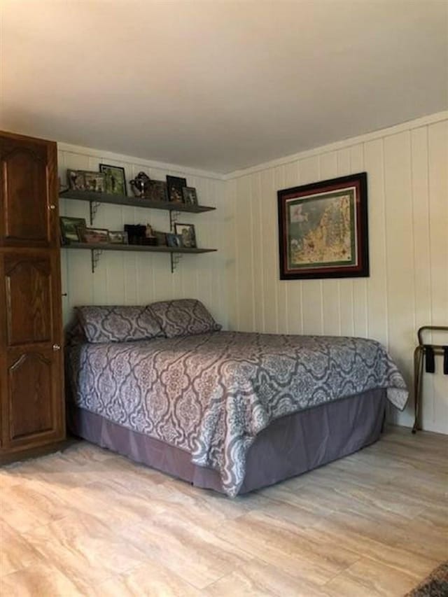 bedroom featuring light wood-style flooring