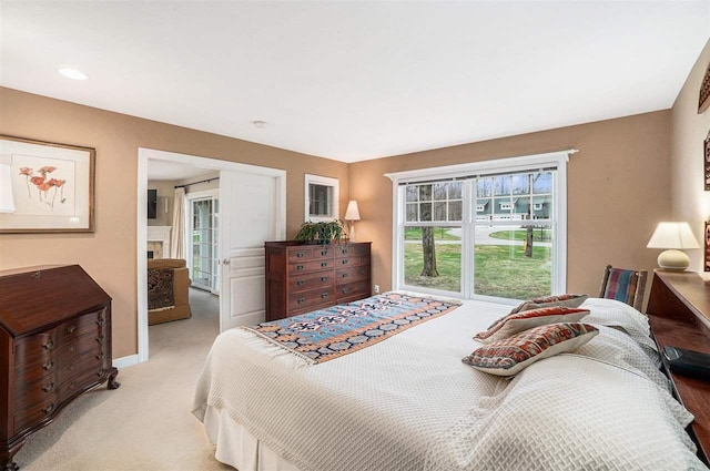 bedroom featuring light carpet
