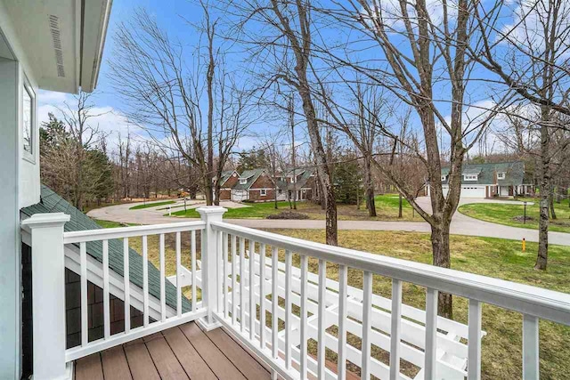 deck with a porch and a residential view