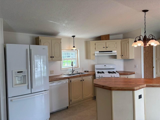kitchen featuring a textured ceiling, a sink, under cabinet range hood, white appliances, and butcher block countertops