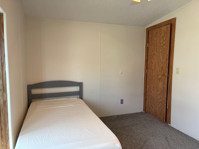 carpeted bedroom featuring a textured ceiling
