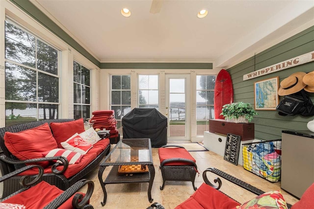 sunroom / solarium featuring crown molding and recessed lighting