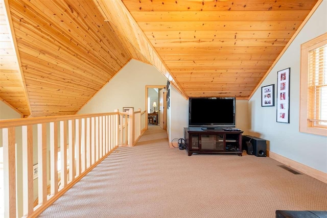interior space with visible vents, carpet flooring, lofted ceiling, and wooden ceiling