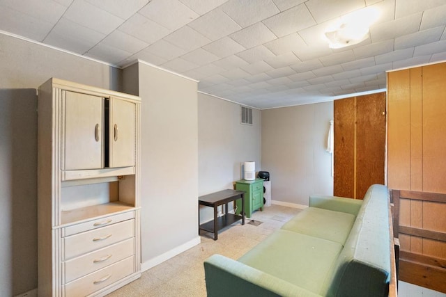 living area featuring visible vents and baseboards