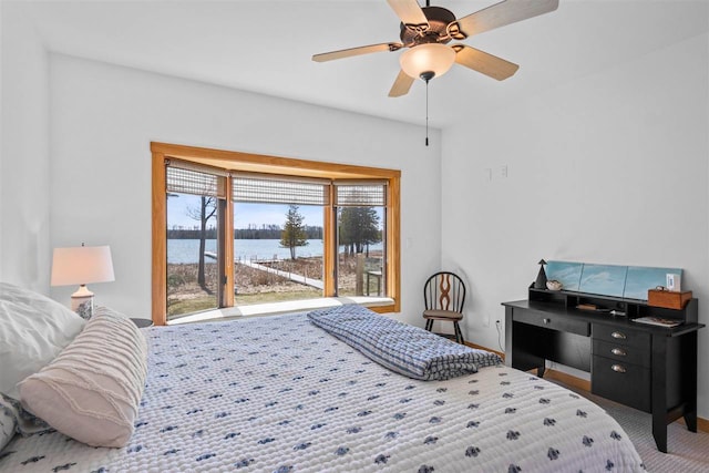 bedroom featuring carpet flooring, a water view, baseboards, and ceiling fan