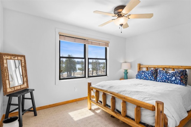 bedroom featuring baseboards and ceiling fan