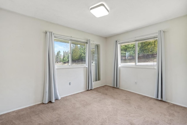 5748 Evergreen Trl, Petoskey, MI 49770 - unfurnished room with carpet floors and baseboards