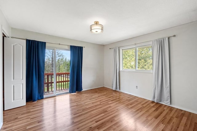 5748 Evergreen Trl, Petoskey, MI 49770 - empty room featuring baseboards and wood finished floors