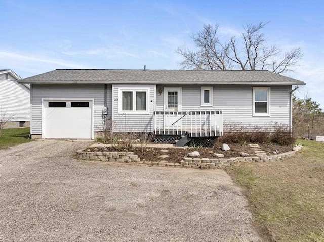 204 Winfield Ave, Petoskey, MI 49770 - ranch-style home with an attached garage, driveway, and roof with shingles