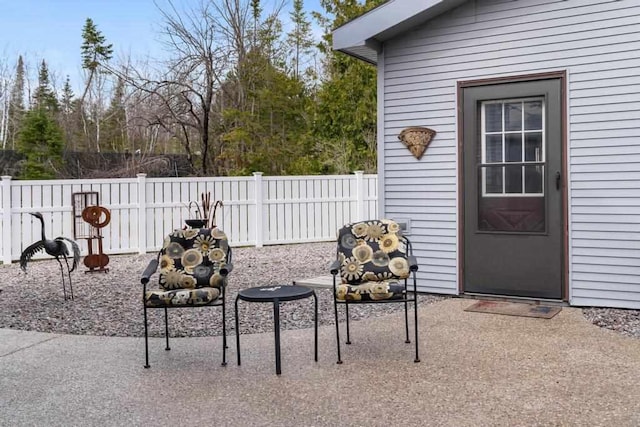 view of patio / terrace featuring fence