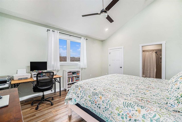 4852 Six Mile Lake Rd, Ellsworth, MI 49729 - bedroom with high vaulted ceiling, recessed lighting, and wood finished floors