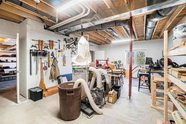 4852 Six Mile Lake Rd, Ellsworth, MI 49729 - basement with a workshop area