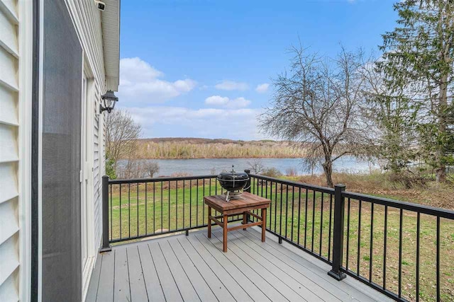 4852 Six Mile Lake Rd, Ellsworth, MI 49729 - wooden terrace featuring a water view and a yard