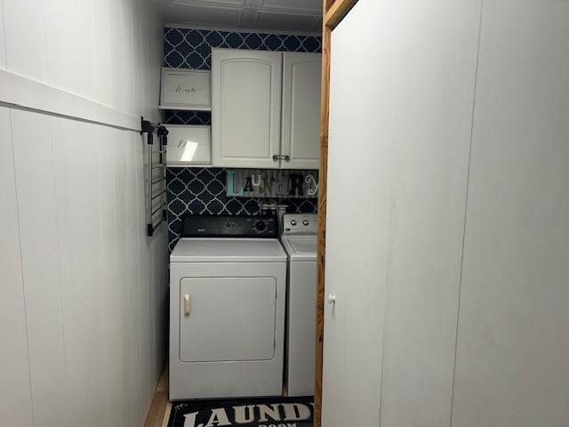 8118 E Mitchell St, Petoskey, MI 49770 - laundry area with cabinet space and washer and dryer