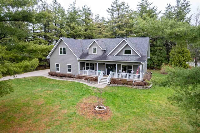 cape cod-style house featuring a porch, roof with shingles, and a front lawn