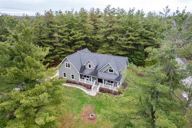 birds eye view of property with a wooded view