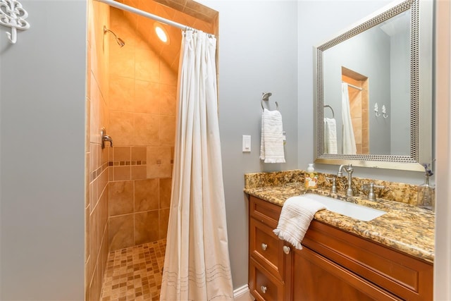 bathroom with vanity and a stall shower