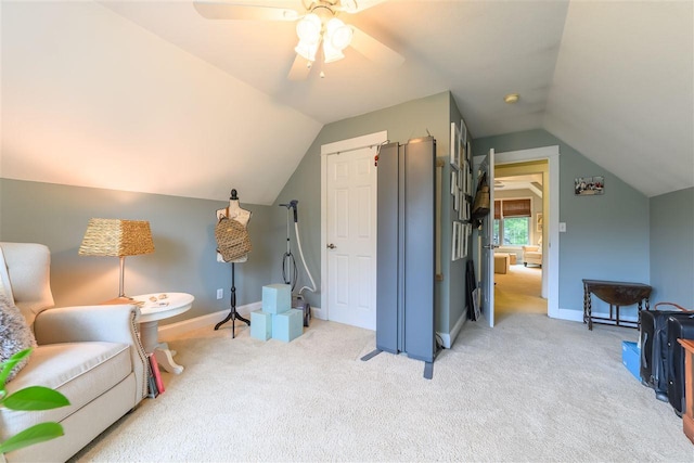 interior space with light colored carpet, a ceiling fan, and lofted ceiling