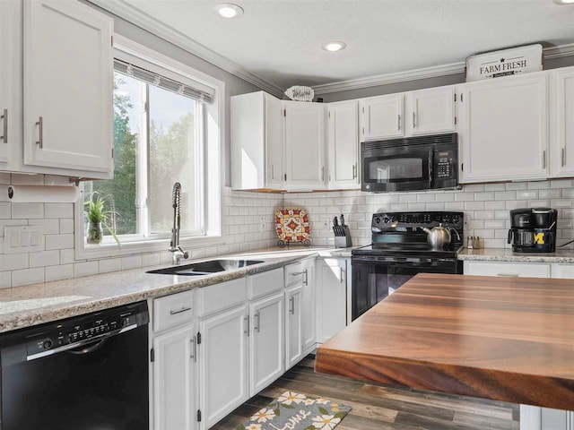 7906 Ferry Rd, East Jordan, MI 49727 - kitchen with white cabinetry, black appliances, dark wood-style floors, and a sink