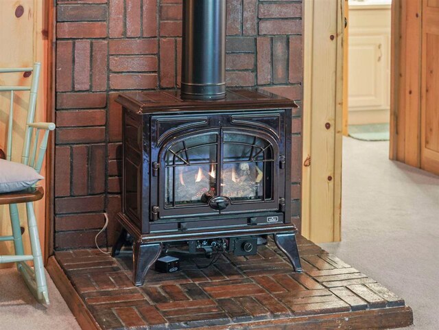 4488 Fourth St, Walloon Lake, MI 49796 - room details featuring a wood stove