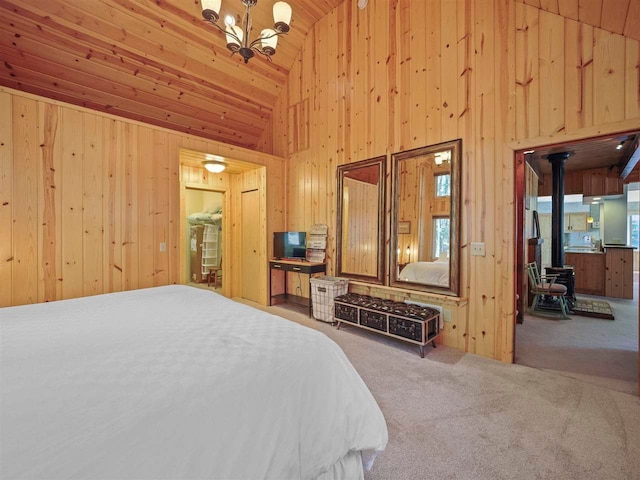 4488 Fourth St, Walloon Lake, MI 49796 - bedroom with wooden ceiling, a wood stove, wooden walls, and high vaulted ceiling