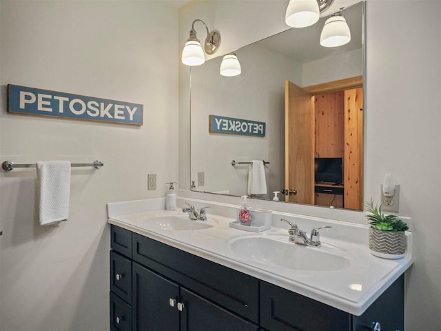 4488 Fourth St, Walloon Lake, MI 49796 - bathroom featuring a sink and double vanity