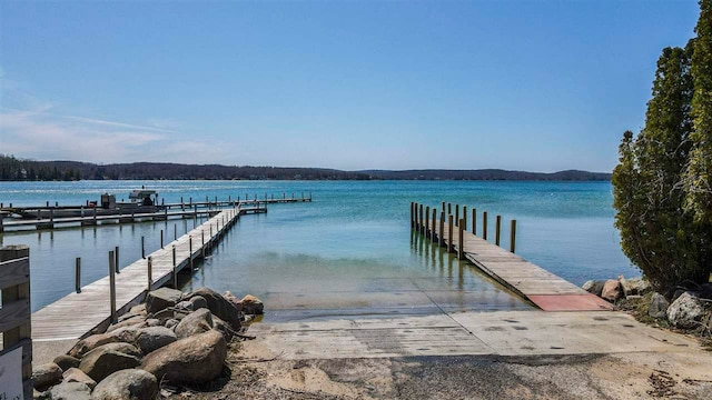 4488 Fourth St, Walloon Lake, MI 49796 - view of dock featuring a water view