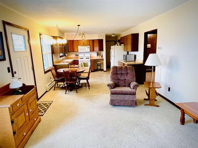 1368 S M-88, Bellaire, MI 49615 - living room with a baseboard radiator, baseboards, an inviting chandelier, crown molding, and light colored carpet