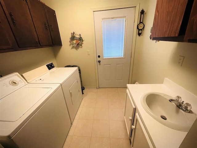 1368 S M-88, Bellaire, MI 49615 - laundry area featuring washer and dryer, baseboards, light tile patterned flooring, and a sink