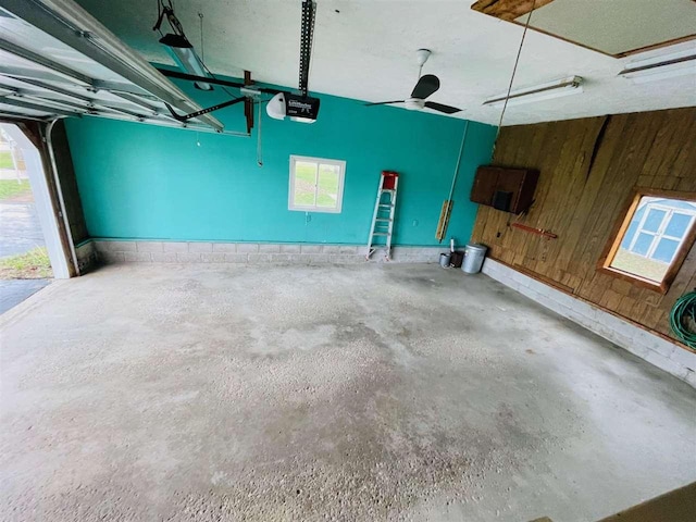 1368 S M-88, Bellaire, MI 49615 - garage with wood walls and a garage door opener