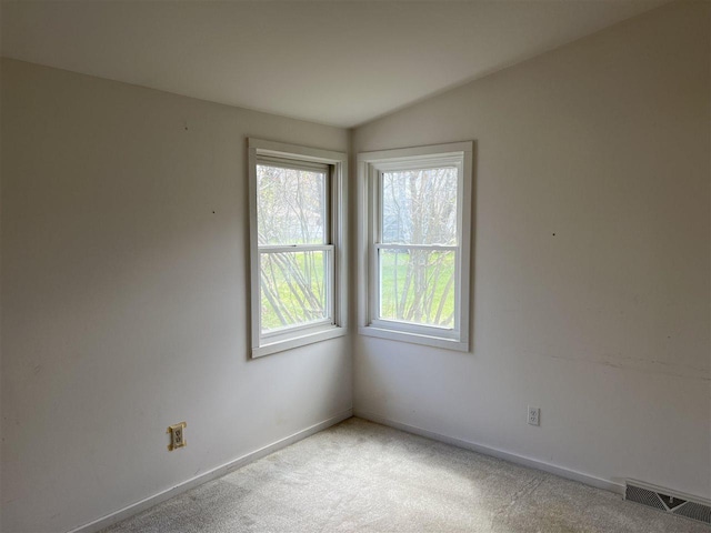 empty room with carpet floors and baseboards